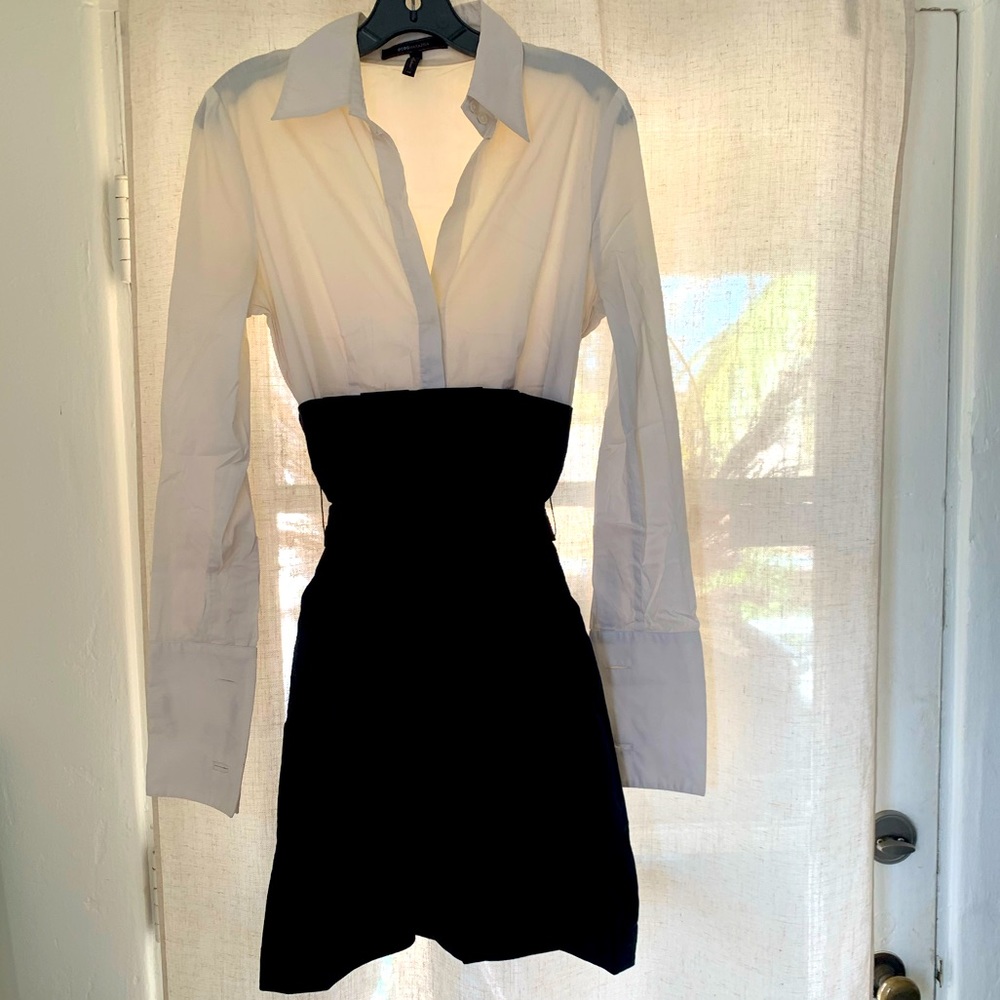 Knee-length black and white dress with French cuffs (and pockets!).